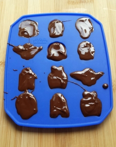 a chocolate mould filled with melted chocolate